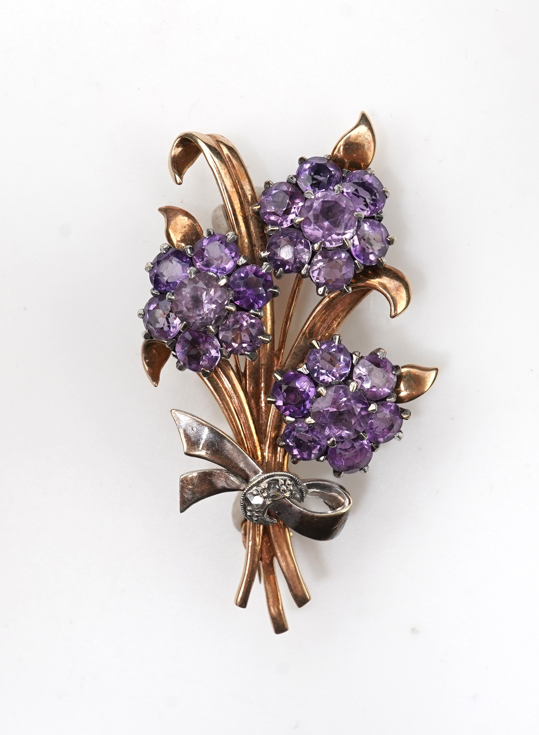 A Retro amethyst and diamond brooch, circa 1956